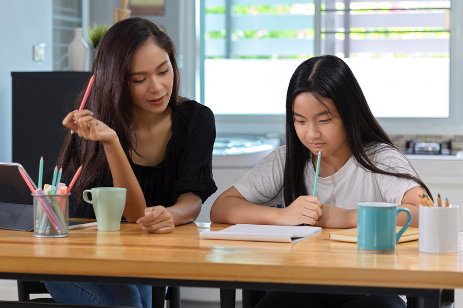 student and tutor together at a desk in San Luis Obispo